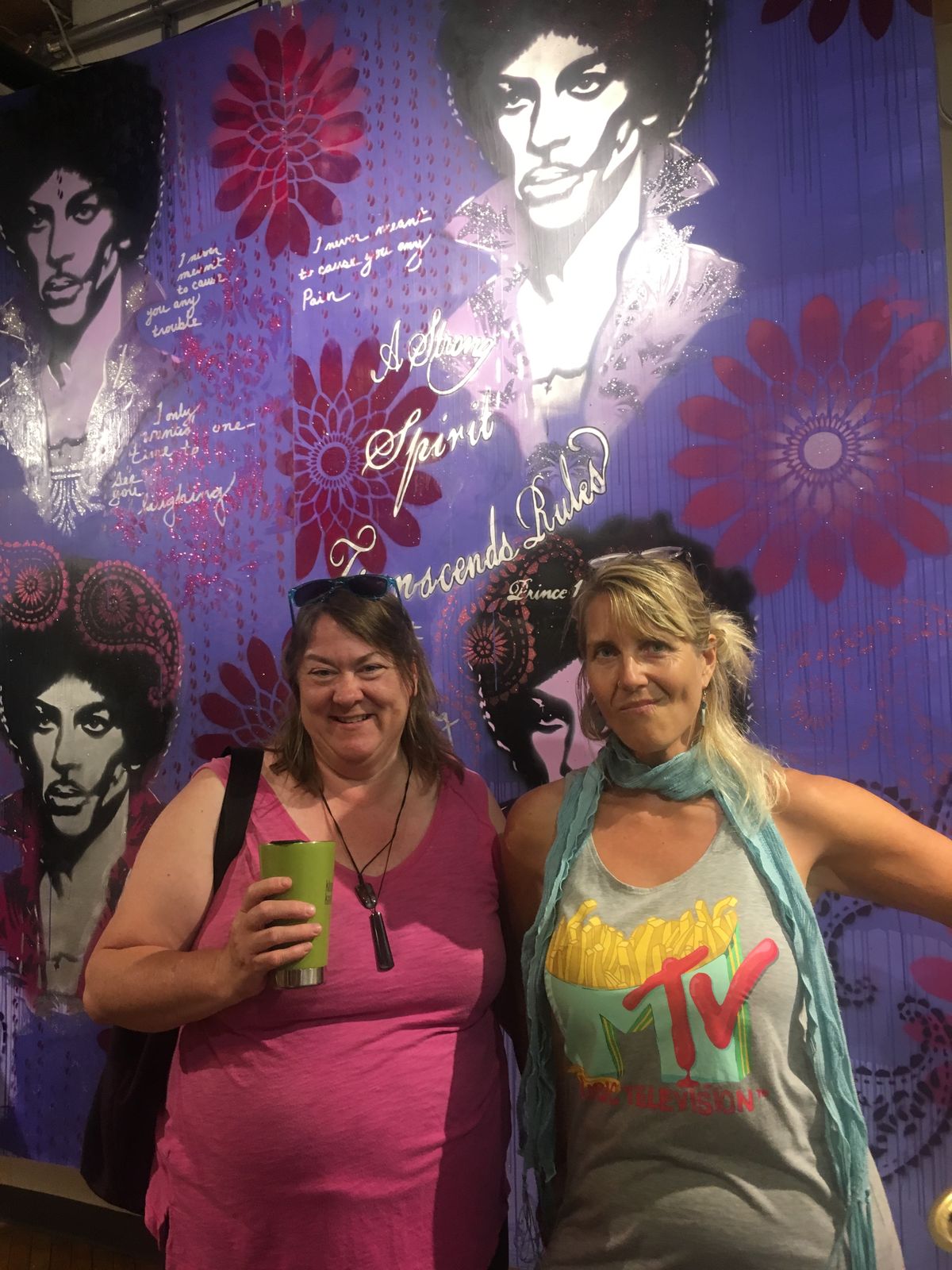 Jill Boogren and Jennifer Umolac in front of work by Erin Sayer, 2018