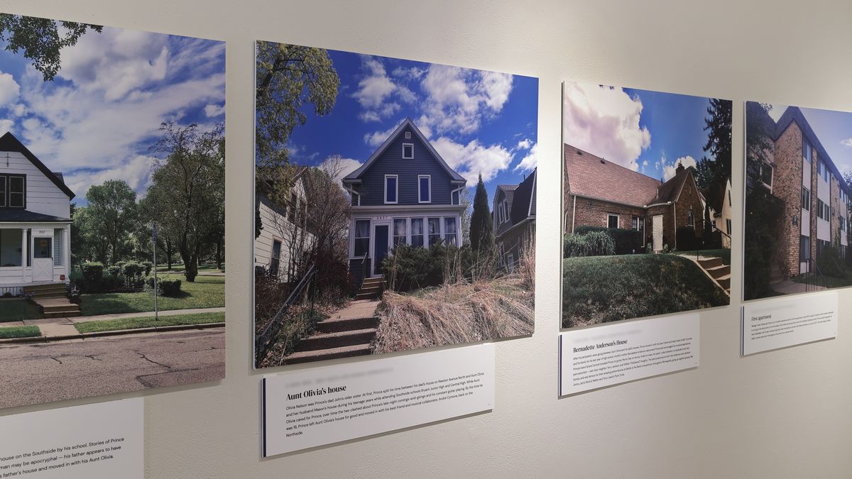 Houses of Prince on the wall at Roberts Gallery: large photographs of Aunt Olivia’s house and Bernadette Anderson’s house, each with its caption card beneath
