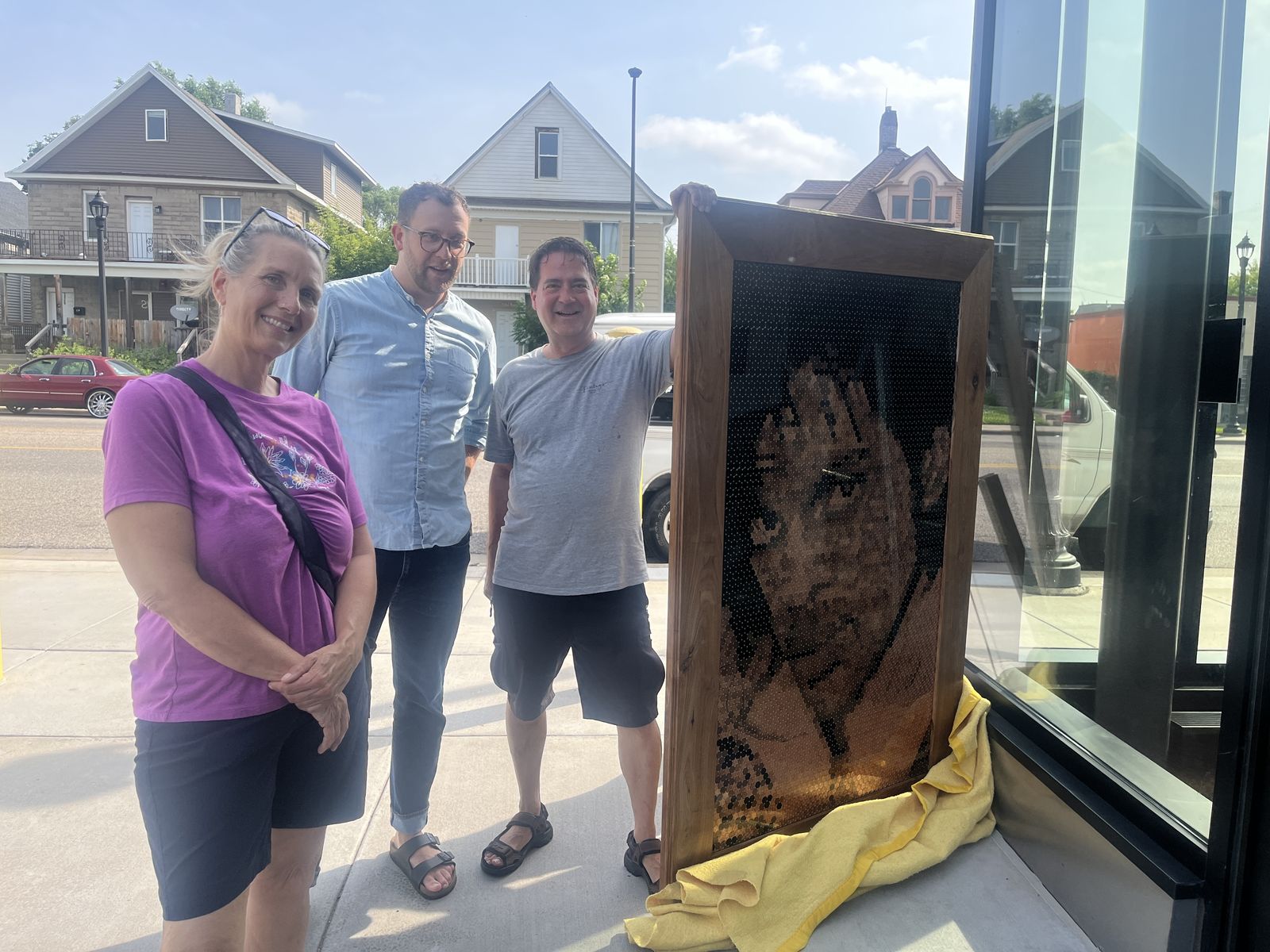 Jennifer Umolac, Nathan Moen and Jeff Boogren delivering Purple Rain by Bethany Tobias to the Capri, 2026